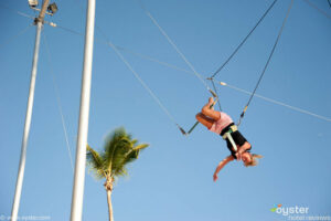 A resortguest gets free trapeze lessons at the Viva Wyndham Dominicus Palace Resort.