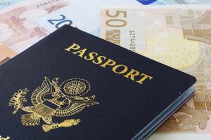 Photo: American passport and euro banknotes via Shutterstock
