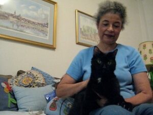Pet psychic Catherine Ferguson at home with one of her cats.