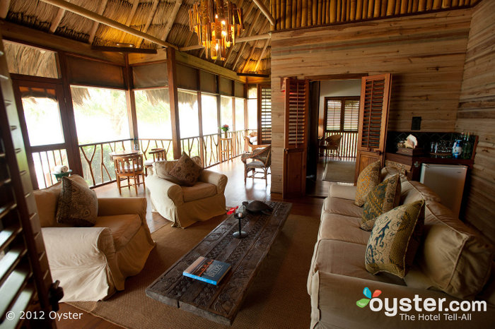 The hotel offers individual cottages and villas with thatched roofs, Balinese decor and screened porches.